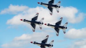Four fighter jets fly in formation.